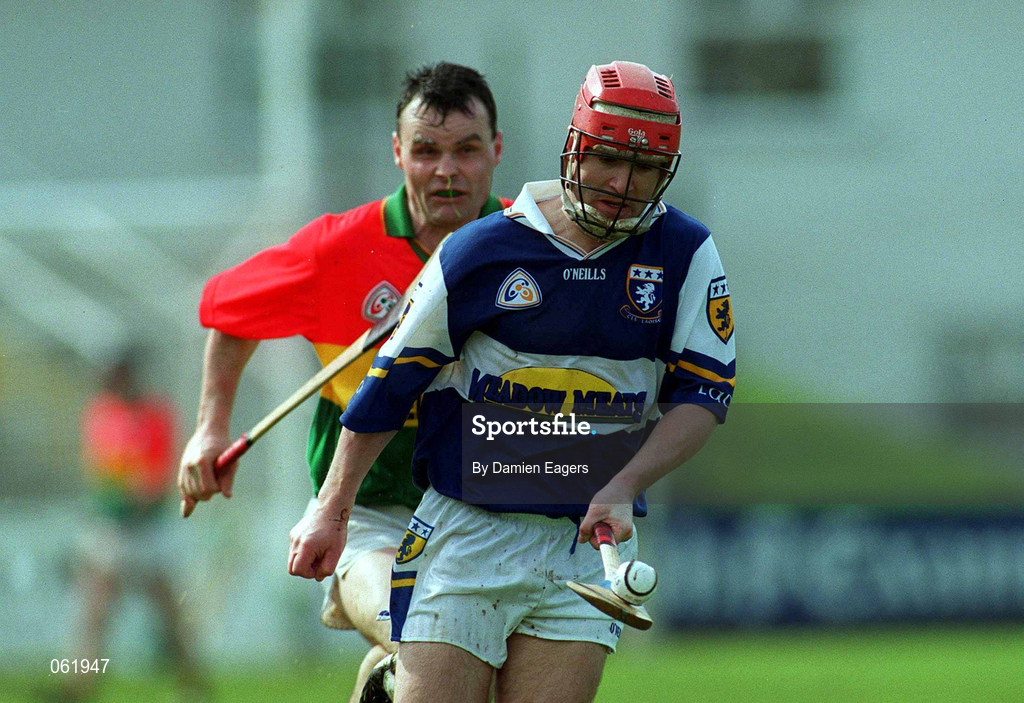 29 April 2001; Fionan O'Sullivan of Laois in action against Johnny Nevin of Carlow during the Guinness Leinster Senior Hurling Championship Preliminary Round match between Carlow and Laois at Dr Cullen Park in Carlow. Photo by Damien Eagers/Sportsfile