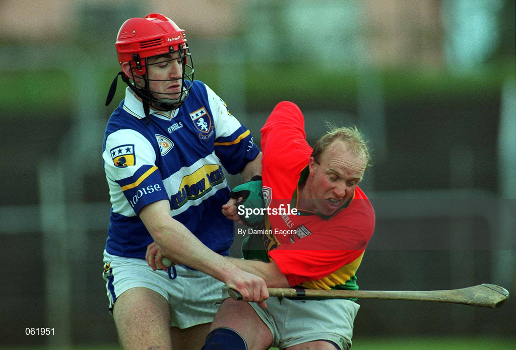29 April 2001; Martin Farrell of Carlow in action against James Young of Laois during the Guinness Leinster Senior Hurling Championship Preliminary Round match between Carlow and Laois at Dr Cullen Park in Carlow. Photo by Damien Eagers/Sportsfile
