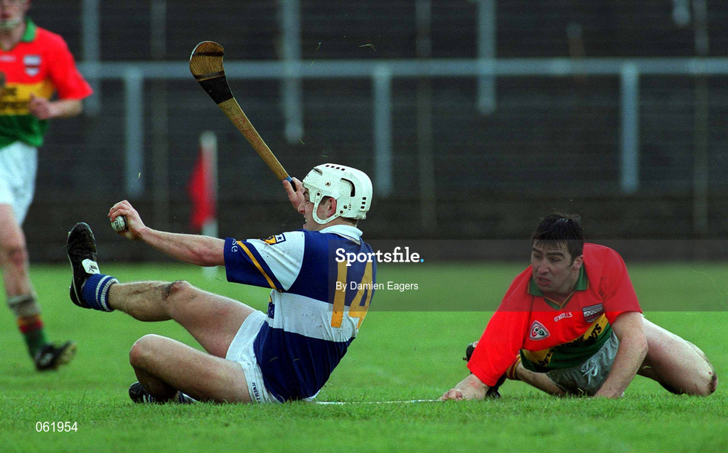 29 April 2001; Darren Rooney of Laois in action against Thomas Doyle of Carlow during the Guinness Leinster Senior Hurling Championship Preliminary Round match between Carlow and Laois at Dr Cullen Park in Carlow. Photo by Damien Eagers/Sportsfile