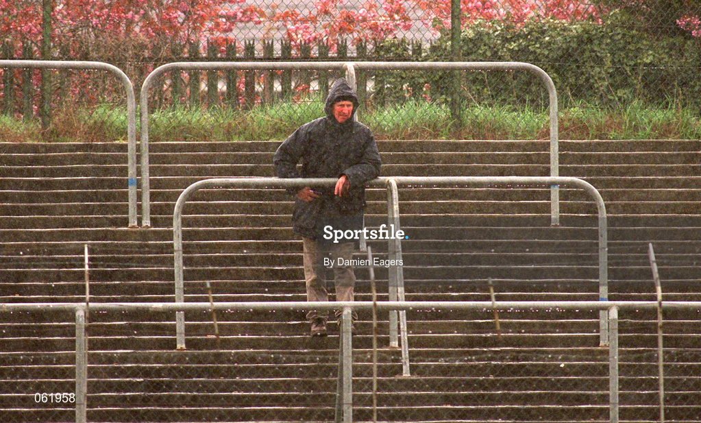 29 April 2001; A fan stands alone in the rain during the Guinness Leinster Senior Hurling Championship Preliminary Round match between Carlow and Laois at Dr Cullen Park in Carlow. Photo by Damien Eagers/Sportsfile