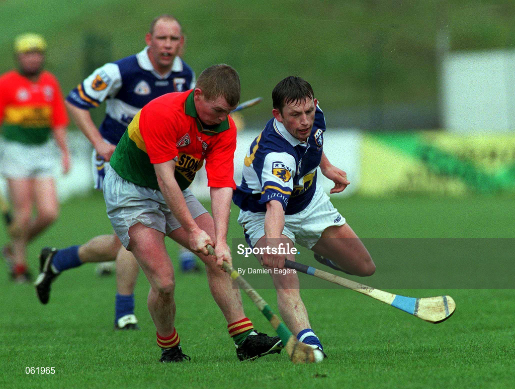 29 April 2001; Andrew Gaule of Carlow in action against Cyril Cuddy of Laois during the Guinness Leinster Senior Hurling Championship Preliminary Round match between Carlow and Laois at Dr Cullen Park in Carlow. Photo by Damien Eagers/Sportsfile
