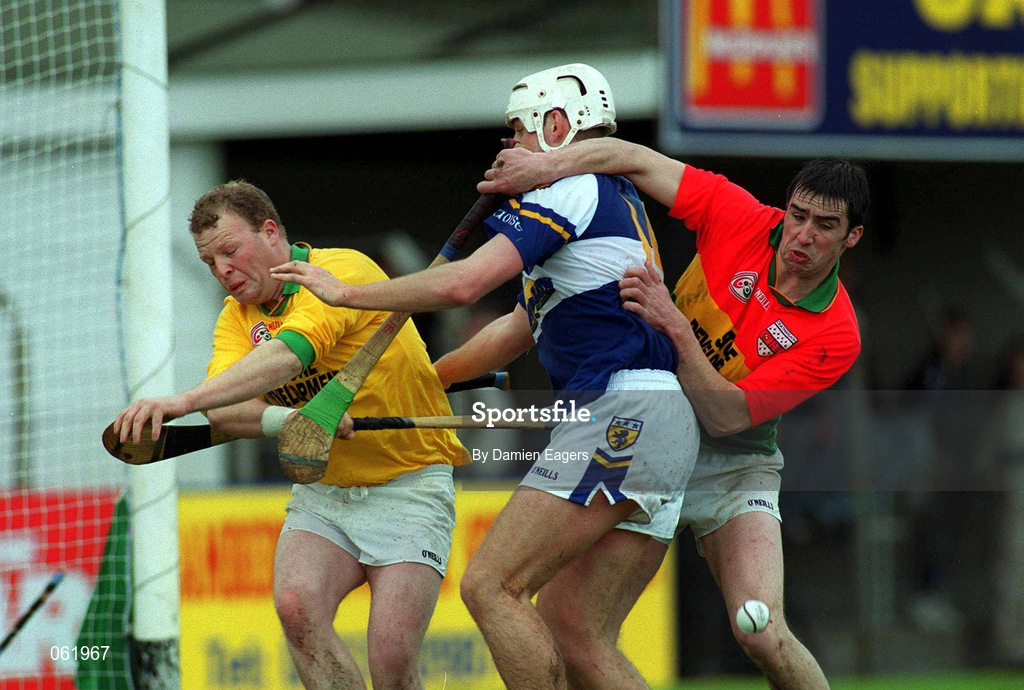 29 April 2001; Darren Rooney of Laois in action against Carlow players Pat Fenlon, goalkeeper, and Thomas Doyle during the Guinness Leinster Senior Hurling Championship Preliminary Round match between Carlow and Laois at Dr Cullen Park in Carlow. Photo by Damien Eagers/Sportsfile