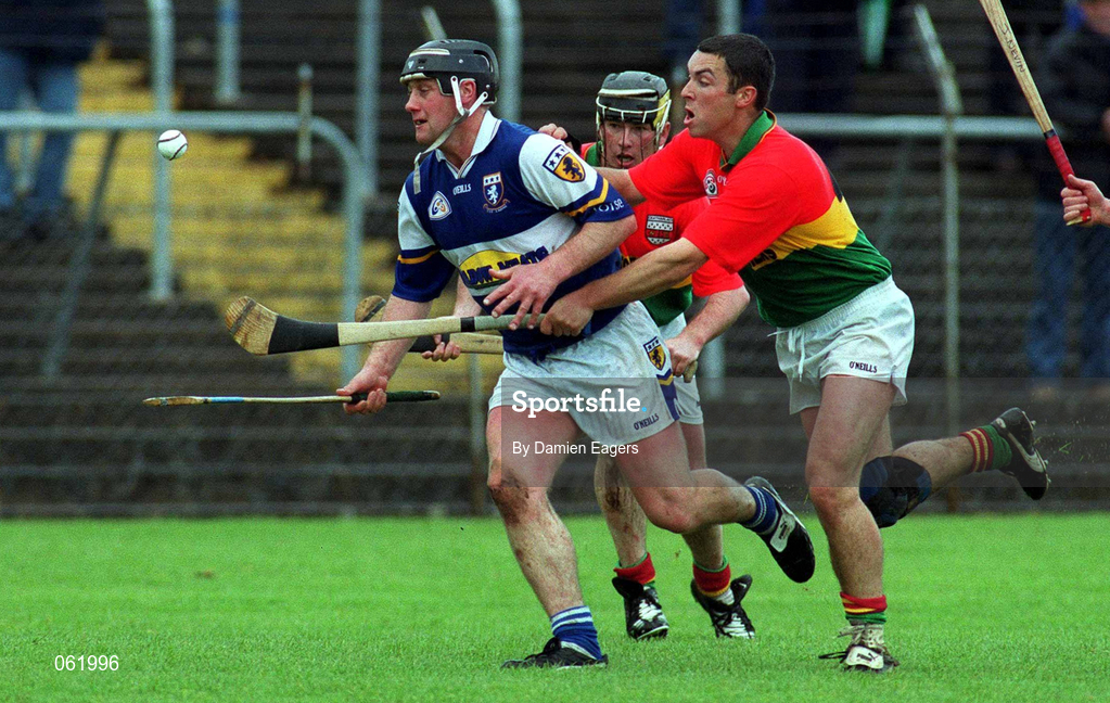 29 April 2001; David Cuddy of Laois in action against Pauric Keogh of Carlow during the Guinness Leinster Senior Hurling Championship Preliminary Round match between Carlow and Laois at Dr Cullen Park in Carlow. Photo by Damien Eagers/Sportsfile