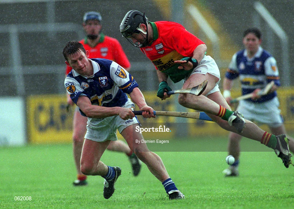 29 April 2001; Cyril Cuddy of Laois in action against Michael Slye of Carlow during the Guinness Leinster Senior Hurling Championship Preliminary Round match between Carlow and Laois at Dr Cullen Park in Carlow. Photo by Damien Eagers/Sportsfile
