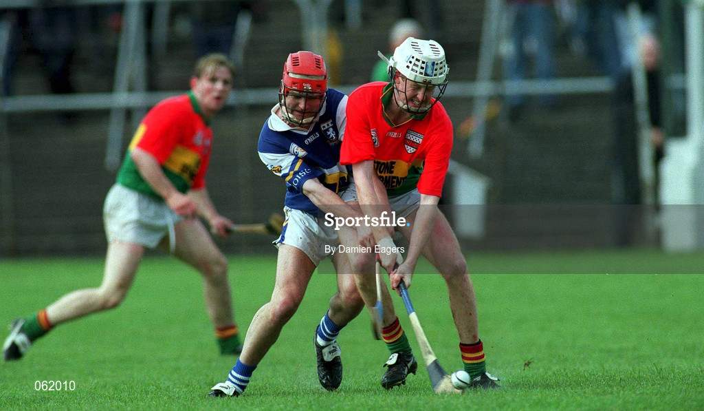 29 April 2001; Fionan O'Sullivan of Laois in action against Edward Coady of Carlow during the Guinness Leinster Senior Hurling Championship Preliminary Round match between Carlow and Laois at Dr Cullen Park in Carlow. Photo by Damien Eagers/Sportsfile