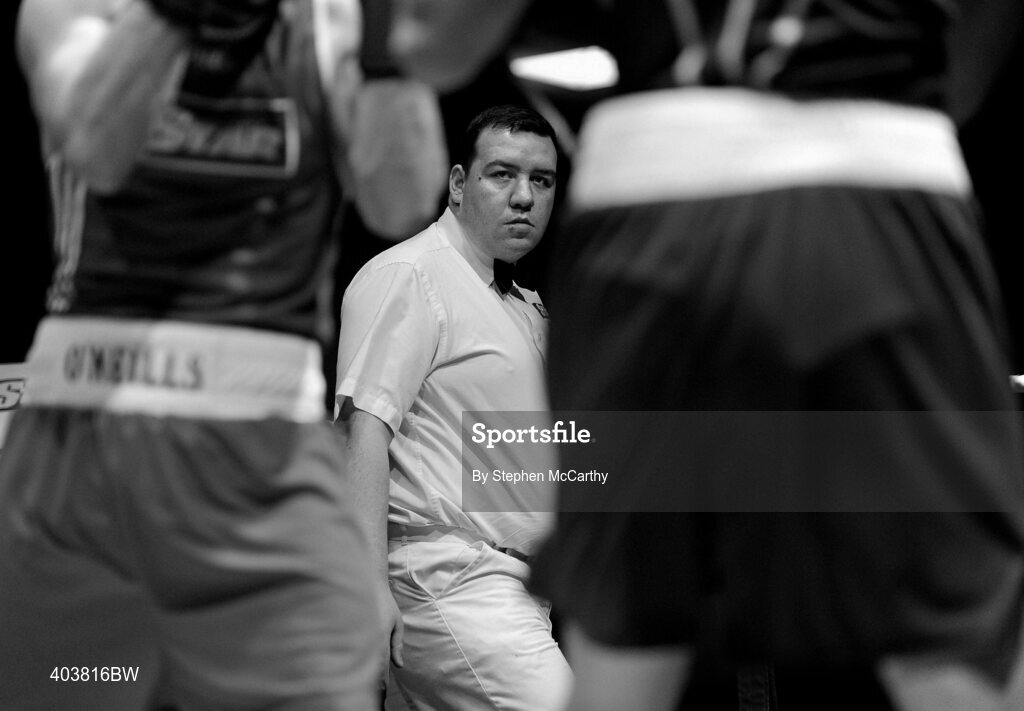 19 February 2010; Referee James McCarron keeps a close eye on the 69kg bout between Ronan Brennan, Dealgan, red, and Shane Murtagh, Crumlin, blue. National Mens and Womens Elite National Boxing Championships, Preliminary Rounds, National Stadium, Dublin. Picture credit: Stephen McCarthy / SPORTSFILE