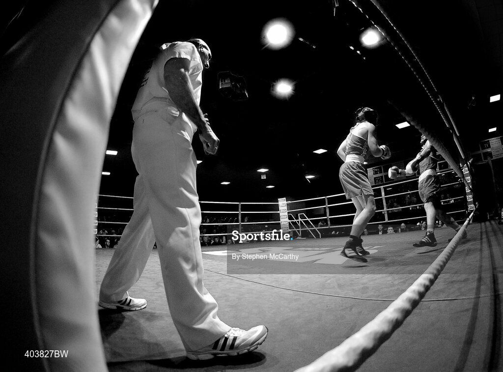 19 February 2010; Luke Keeler, Crumlin, blue, and Andrew Jennings, St Matthews, red, during their their 75kg bout. National Mens and Womens Elite National Boxing Championships, Preliminary Rounds, National Stadium, Dublin. Picture credit: Stephen McCarthy / SPORTSFILE