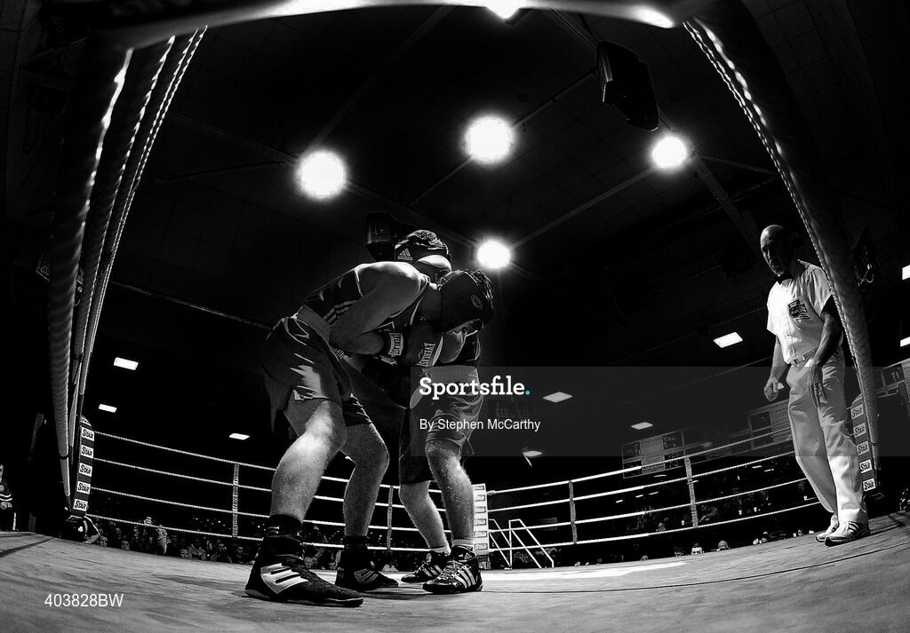 19 February 2010; Luke Keeler, Crumlin, blue, and Andrew Jennings, St Matthews, red, during their their 75kg bout. National Mens and Womens Elite National Boxing Championships, Preliminary Rounds, National Stadium, Dublin. Picture credit: Stephen McCarthy / SPORTSFILE