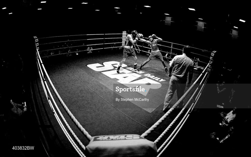 19 February 2010; Mark McNamara, St Francis Limerick, red, exchanges punches with Fergal Redmond, Arklow, blue, during their 69kg bout. National Mens and Womens Elite National Boxing Championships, Preliminary Rounds. National Stadium, Dublin. Picture credit: Stephen McCarthy / SPORTSFILE