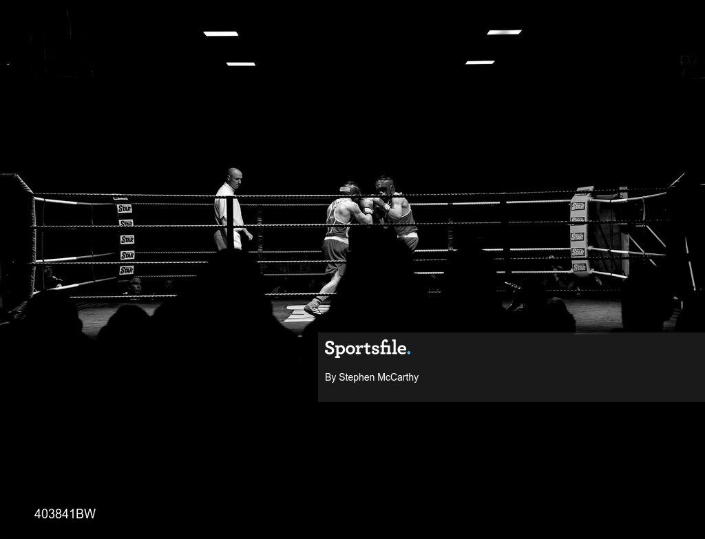 19 February 2010; Francis Campbell, South Meath, red, exchanges punches with James Cyrus, Immaculata, blue, during their 57kg bout. National Mens and Womens Elite National Boxing Championships, Preliminary Rounds. National Stadium, Dublin. Picture credit: Stephen McCarthy / SPORTSFILE