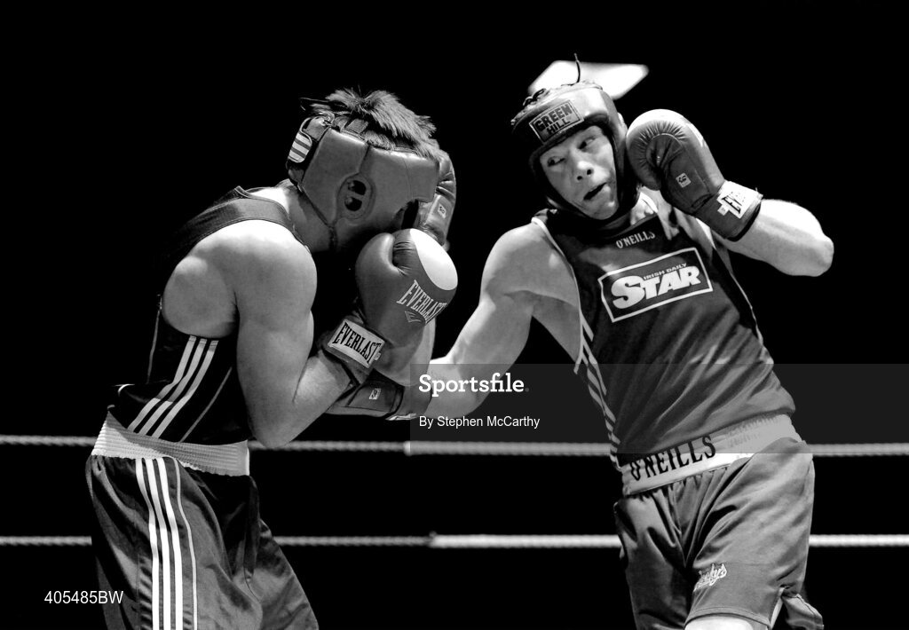 20 February 2010; Ray Moylette, St Annes, blue, exchanges punches with Philip Sutcliffe, Crumlin, red, during their 64kg bout. National Boxing Championships - Semi-Finals, National Stadium, Dublin. Picture credit: Stephen McCarthy / SPORTSFILE