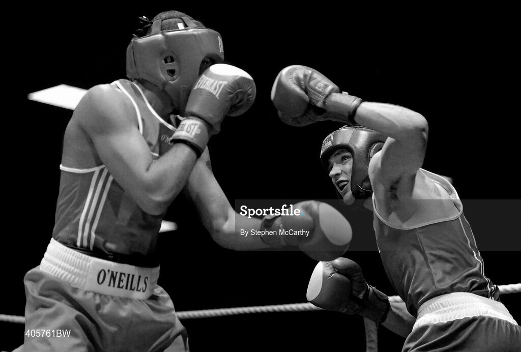 27 February 2010; Tommy McCarthy, Oliver Plunkett, red, exchanges punches with Michael Ward, St Ailbhes, blue, during their 81kg bout. National Mens Elite Championships Semi-Finals - Saturday, National Stadium, Dublin. Picture credit: Stephen McCarthy / SPORTSFILE