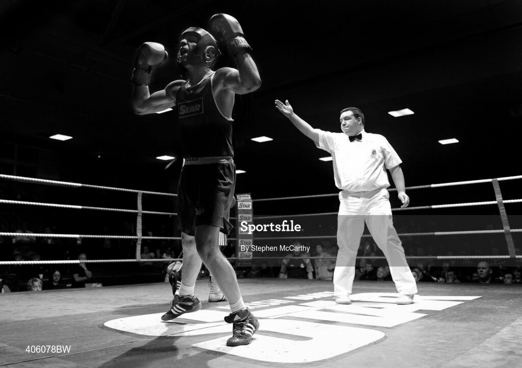 20 February 2010; Ray Moylett, St Annes, blue, celebrates his victory over Philip Sutcliffe, Crumlin, red, during their 64kg bout. National Boxing Championships - Semi-Finals, National Stadium, Dublin. Picture credit: Stephen McCarthy / SPORTSFILE