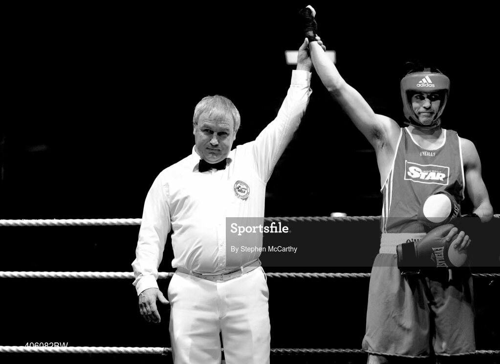 20 February 2010; Darren O'Neill, Paulstown, is announced victorious by referee Frank Ward following a walk-over from Tom O'Donnell, Ballymun. National Boxing Championships - Semi-Finals, National Stadium, Dublin. Picture credit: Stephen McCarthy / SPORTSFILE