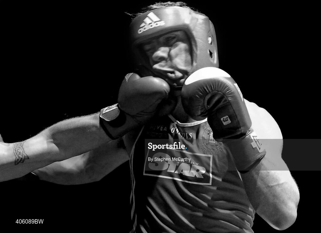 20 February 2010; Denis Hogan, Grangecon, lands a left, on Kenny Egan, Neilstown, during their 81kg bout. National Boxing Championships - Semi-Finals, National Stadium, Dublin. Picture credit: Stephen McCarthy / SPORTSFILE