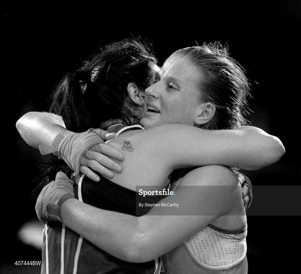 5 March 2010; Kelly Harrington, West Finglas, left, embraces Jessica Lyons, St Francis, Limerick, following their elite women's 69kg final bout. National Men's & Women's Elite National Championships 2010 Finals - Friday, National Stadium, Dublin. Picture credit: Stephen McCarthy / SPORTSFILE