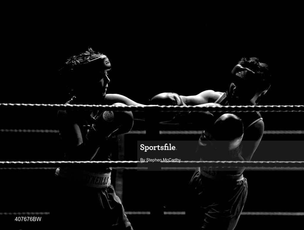 6 March 2010; Sabrina Hughes, Ryston, right, exchanges punches with Mairead Keane, Ballinacarrow, during their women's novice 60kg final bout. Men's Elite & Women's Novice National Championships 2010 Finals - Saturday Evening Session, National Stadium, Dublin. Picture credit: Stephen McCarthy / SPORTSFILE