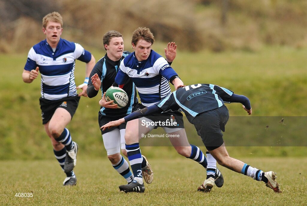 3 March 2010; Shaun Horgan, Rockwell, is takled by Andrew Fullen, left, and Padraig Quinn, Castletroy. Avonmore Munster Rugby Schools Senior Cup Semi-Final, Rockwell v Castletroy College, Clanwilliam Park, Tipperary Town, Tipperary. Picture credit: Diarmuid Greene / SPORTSFILE