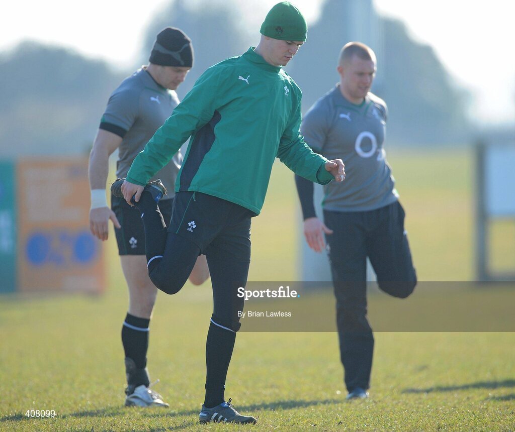 9 March 2010; Ireland's Jonathan Sexton with David Wallace, left, and Keith Earls, right, stretches during rugby squad training ahead of their RBS Six Nations Rugby Championship match against Wales on Saturday. Dr. Hickey Park, Greystones, Co. Wicklow. Picture credit; Brian Lawless / SPORTSFILE
