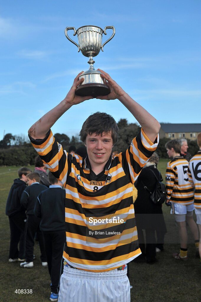 10 March 2010; Colaiste Eoin captain Roibeard Mac Daibhéad lifts the cup. Dublin School Junior Football A Final, St Benildus College v Colaiste Eoin, UCD, Belfield, Dublin. Picture credit: Brian Lawless / SPORTSFILE