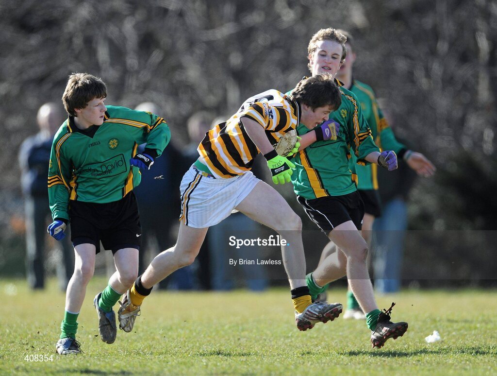 10 March 2010; Maitias MacDonncha, Colaiste Eoin, in action against Alan Kennedy, left, Shane Cunningham, St Benildus College. Dublin School Junior Football A Final, St Benildus College v Colaiste Eoin, UCD, Belfield, Dublin. Picture credit: Brian Lawless / SPORTSFILE