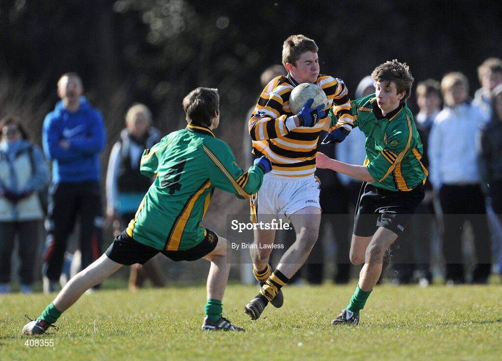10 March 2010; Dónal Ó Gormlaigh, Colaiste Eoin, in action against Paul Fallon, left, and Ross McGowan, St Benildus College. Dublin School Junior Football A Final, St Benildus College v Colaiste Eoin, UCD, Belfield, Dublin. Picture credit: Brian Lawless / SPORTSFILE