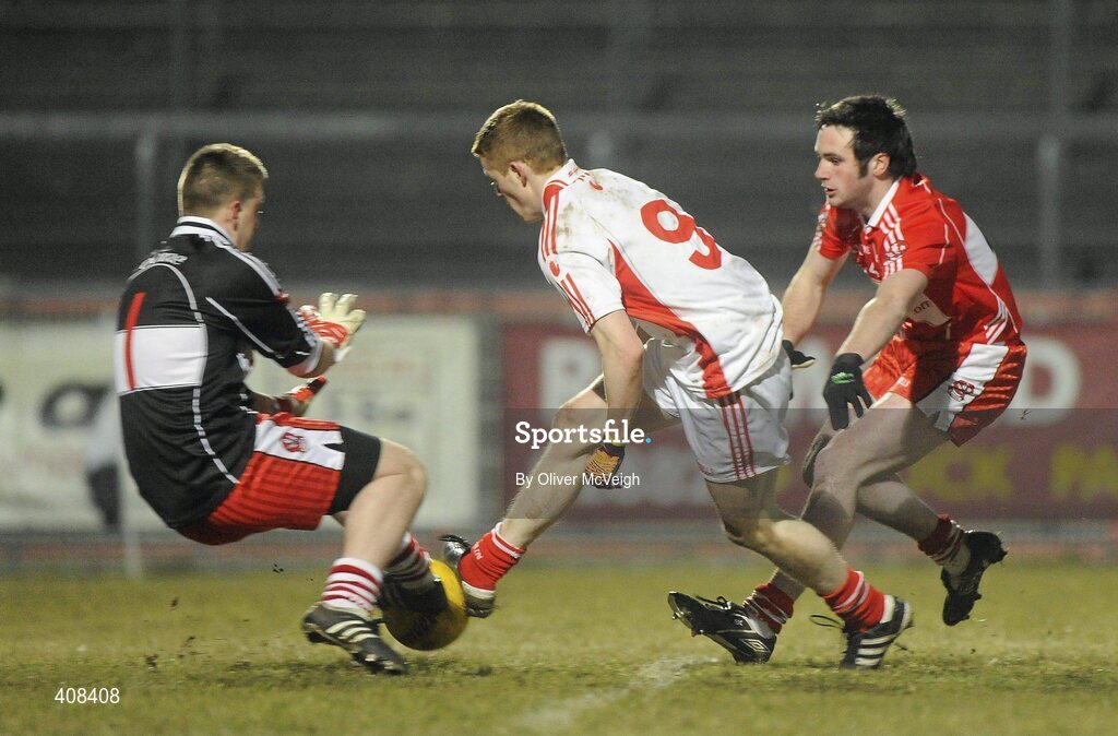 10 March 2010; Tyrone's Niall McKenna has his shot saved by Derry goalkeeper Andrew Warnock. Cadbury Ulster GAA Football Under 21 Championship, Preliminary Round, Tyrone v Derry, Healy Park, Omagh, Co. Tyrone. Picture credit: Oliver McVeigh / SPORTSFILE