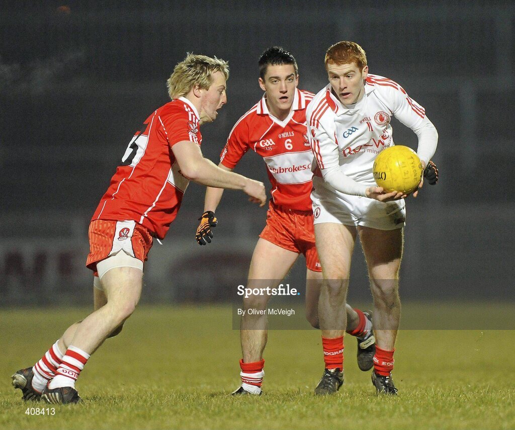 10 March 2010; Peter Harte, Tyrone, in action against Ciaran McFeeley, Derry. Cadbury Ulster GAA Football Under 21 Championship, Preliminary Round, Tyrone v Derry, Healy Park, Omagh, Co. Tyrone. Picture credit: Oliver McVeigh / SPORTSFILE