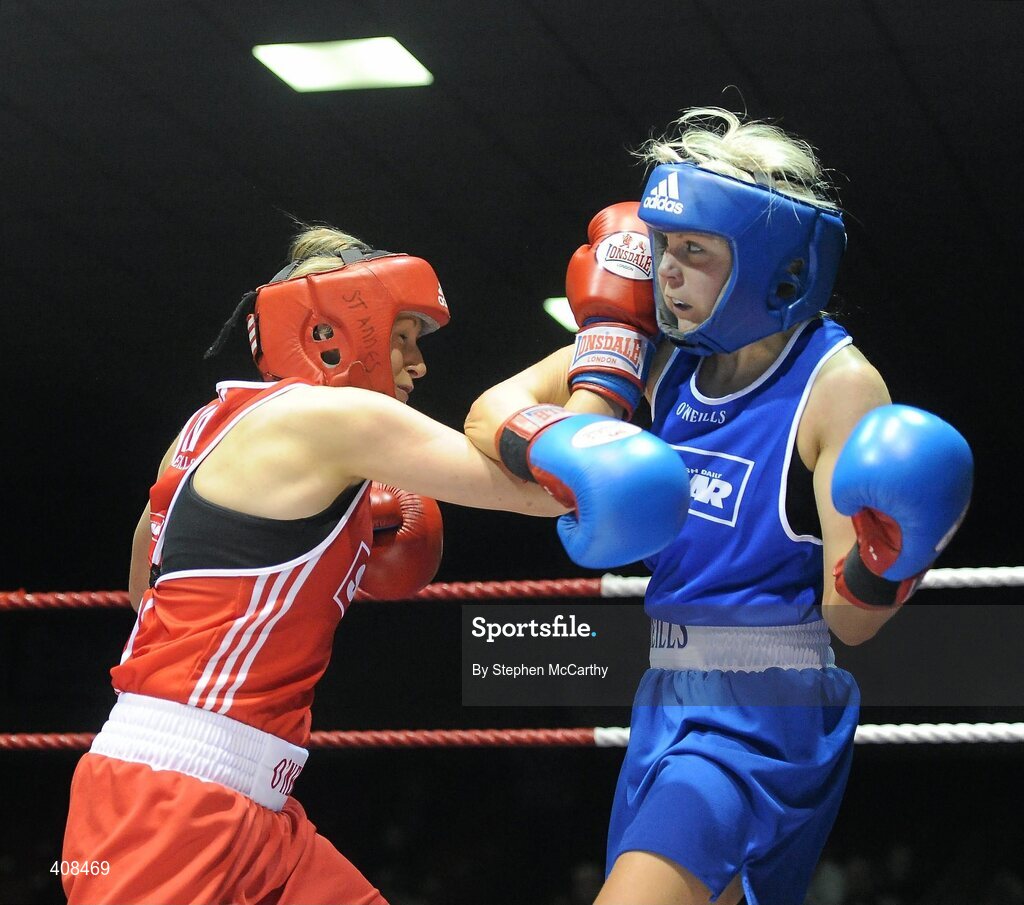 6 March 2010; Sharon McGing, St Annes Westport, left, exchanges punches with Amanda Loughlin, Bray, during her women'd novice 54kg final bout. Men's Elite & Women's Novice National Championships 2010 Finals - Saturday Evening Session, National Stadium, Dublin. Picture credit: Stephen McCarthy / SPORTSFILE