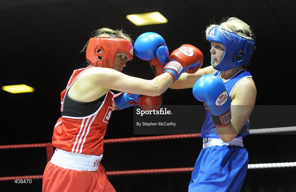 6 March 2010; Sharon McGing, St Annes Westport, left, exchanges punches with Amanda Loughlin, Bray, during her women'd novice 54kg final bout. Men's Elite & Women's Novice National Championships 2010 Finals - Saturday Evening Session, National Stadium, Dublin. Picture credit: Stephen McCarthy / SPORTSFILE