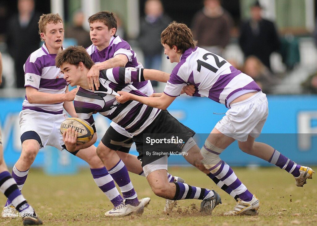 11 March 2010; Gary Clarkin, Terenure College, is tackled by Clongowes Wood College SJ players, from left, Alex Dudeney, Jack Murphy and Daniel O'Sullivan. Leinster Schools Junior Cup Semi-Final, Clongowes Wood College SJ v Terenure College, Donnybrook Stadium, Donnybrook, Dublin. Picture credit: Stephen McCarthy / SPORTSFILE