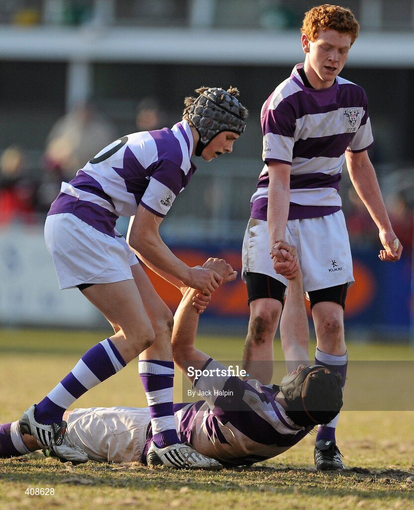 11 March 2010; Clongowes Wood College SJ players Iain Brady, left, and Cormac Gillick console Oscar Hassett following their side's defeat. Leinster Schools Junior Cup Semi-Final, Clongowes Wood College SJ v Terenure College, Donnybrook Stadium, Donnybrook, Dublin. Picture credit: Jack Halpin / SPORTSFILE