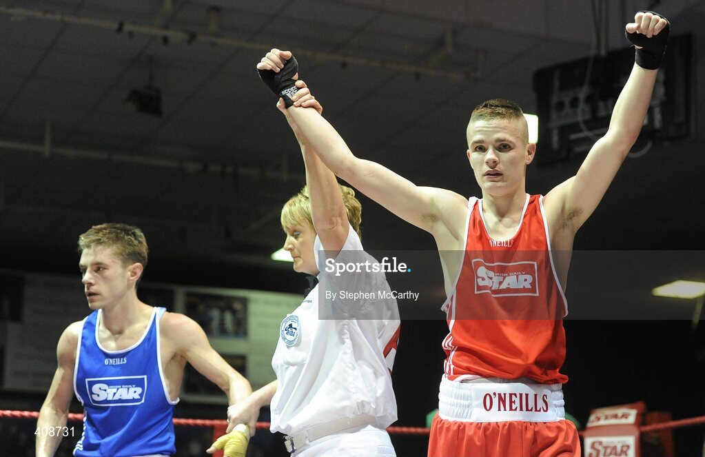 6 March 2010; Gary Molloy, Moate, is announced victorious, by referee Sadie Duffy, over Conor Ahern, Baldoyle, following their men's elite 51kg final bout. Men's Elite & Women's Novice National Championships 2010 Finals - Saturday Evening Session, National Stadium, Dublin. Picture credit: Stephen McCarthy / SPORTSFILE