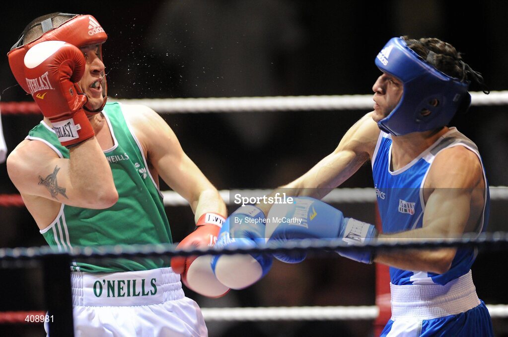 12 March 2010; John Joe Nevin, Ireland, exchanges punches with Vittorio Parrinello, Italy, during their 54kg bout. Elite International, National Stadium, Dublin. Picture credit: Stephen McCarthy / SPORTSFILE