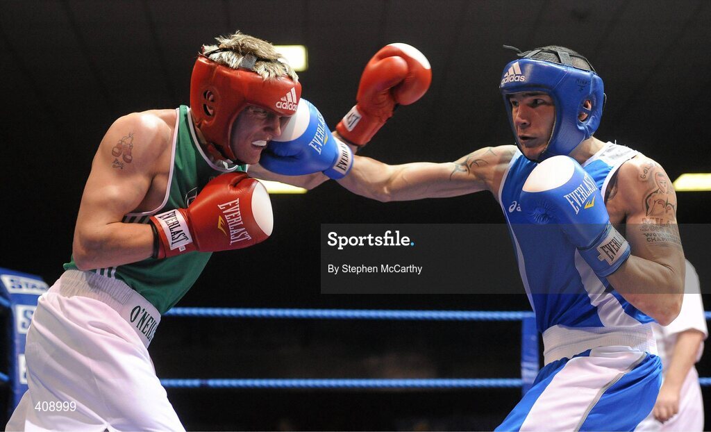 12 March 2010; Eric Donovan, Ireland, exchanges punches with Domenico Valentino, Italy, during their 60Kg bout. Elite International, National Stadium, Dublin. Picture credit: Stephen McCarthy / SPORTSFILE
