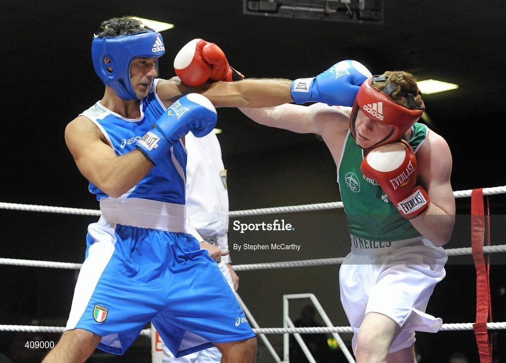 12 March 2010; Ray Moylette, Ireland, exchanges punches with Vincenzo Manggiacapre, Italy, during their 64kg bout. Elite International, National Stadium, Dublin. Picture credit: Stephen McCarthy / SPORTSFILE