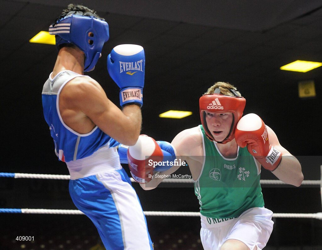 12 March 2010; Ray Moylette, Ireland, exchanges punches with Vincenzo Manggiacapre, Italy, during their 64kg bout. Elite International, National Stadium, Dublin. Picture credit: Stephen McCarthy / SPORTSFILE