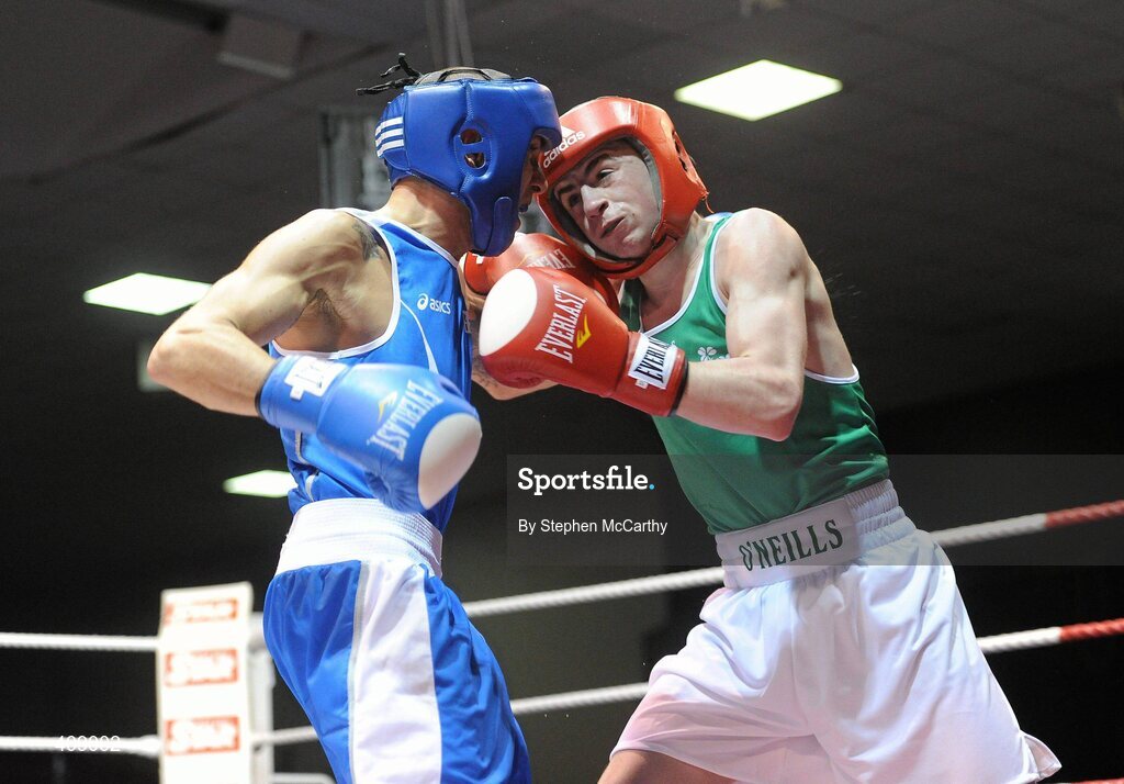 12 March 2010; Tyrone McCullagh, Ireland, exchanges punches with Alessio Di Sevino, Italy, during their 57kg bout. Elite International, National Stadium, Dublin. Picture credit: Stephen McCarthy / SPORTSFILE