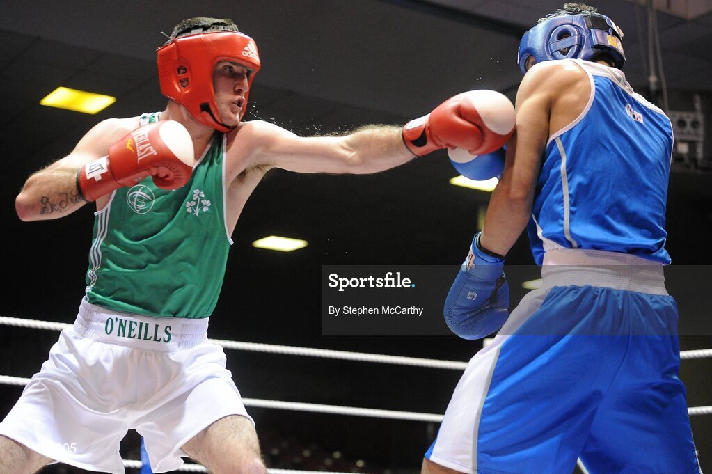 12 March 2010; John Joe Joyce, Ireland, exchanges punches with Diego Di Luisa, Italy, during their 69kg bout. Elite International, National Stadium, Dublin. Picture credit: Stephen McCarthy / SPORTSFILE