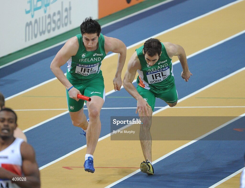 13 March 2010; Ireland's Brian Greegan takes the batton from team-mate Nick Hogan, right, during the Men's 4x400m Relay heats. The Ireland team finished in 6th place in their heat at the 13th IAAF World Indoor Athletics Championships, Doha, Qatar. Picture credit: Pat Murphy / SPORTSFILE