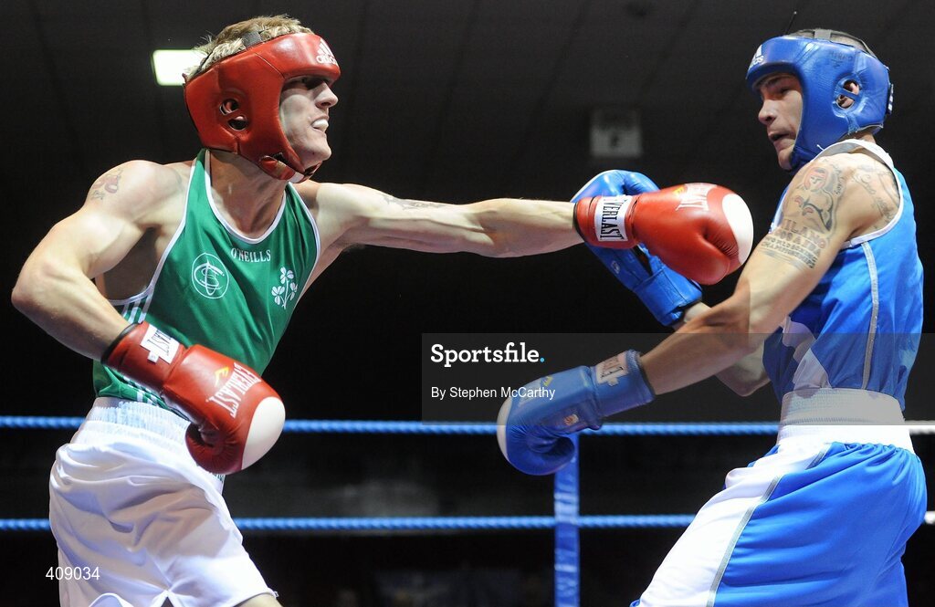 12 March 2010; Eric Donovan, Ireland, exchanges punches with Domenico Valentino, Italy, during their 60Kg bout. Elite International, National Stadium, Dublin. Picture credit: Stephen McCarthy / SPORTSFILE