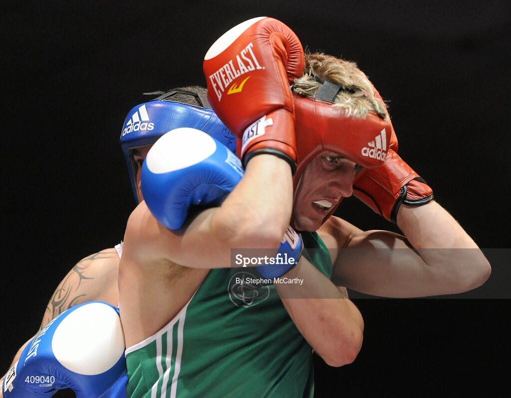 12 March 2010; Eric Donovan, Ireland, and Domenico Valentino, Italy, during their 60kg bout. Elite International, National Stadium, Dublin. Picture credit: Stephen McCarthy / SPORTSFILE