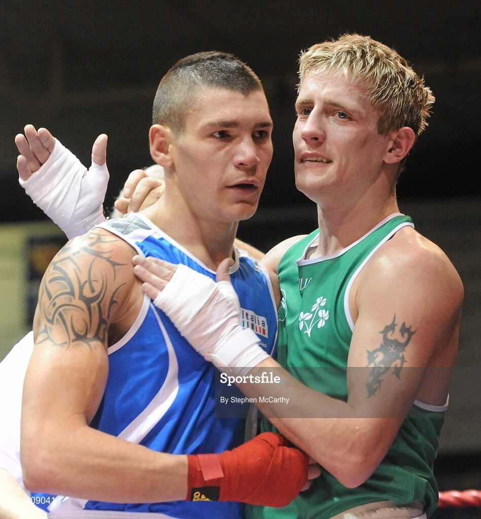 12 March 2010; Eric Donovan, Ireland, and Domenico Valentino, Italy, following their 60kg bout. Elite International, National Stadium, Dublin. Picture credit: Stephen McCarthy / SPORTSFILE
