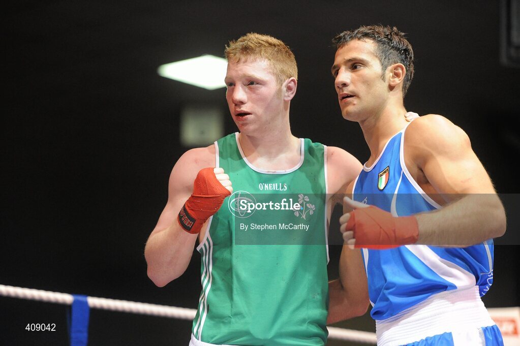 12 March 2010; Ray Moylett, Ireland, and Vincenzo Manggiacapre, Italy, following their 64kg bout. Elite International, National Stadium, Dublin. Picture credit: Stephen McCarthy / SPORTSFILE