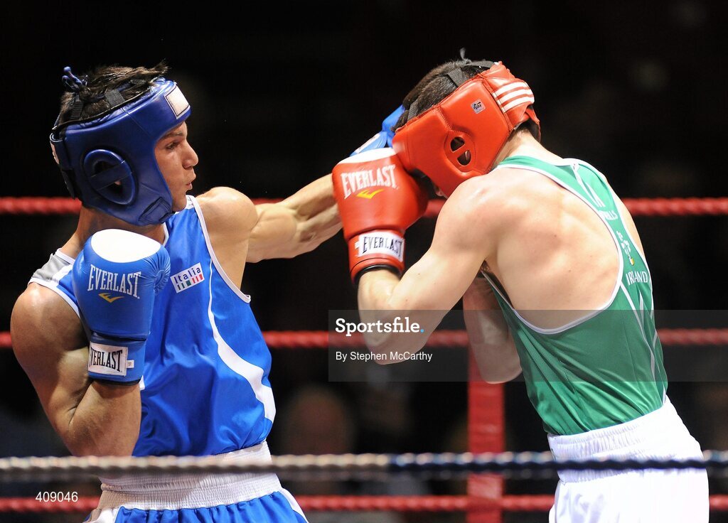 12 March 2010; Darren O'Neill, Ireland, exchanges punches with Luca Podda, Italy, during their 75kg bout. Elite International, National Stadium, Dublin. Picture credit: Stephen McCarthy / SPORTSFILE