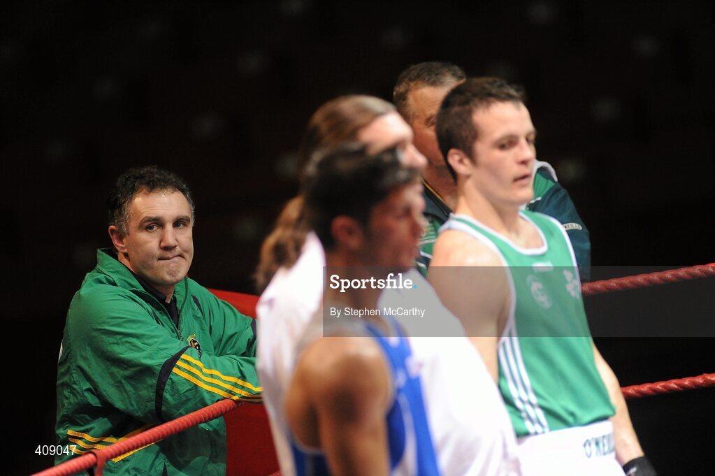 12 March 2010; Ireland coach Billy Walsh watches on as Darren O'Neill, Ireland, and Luca Podda, Italy, await the decision of their 75kg bout. Elite International, National Stadium, Dublin. Picture credit: Stephen McCarthy / SPORTSFILE