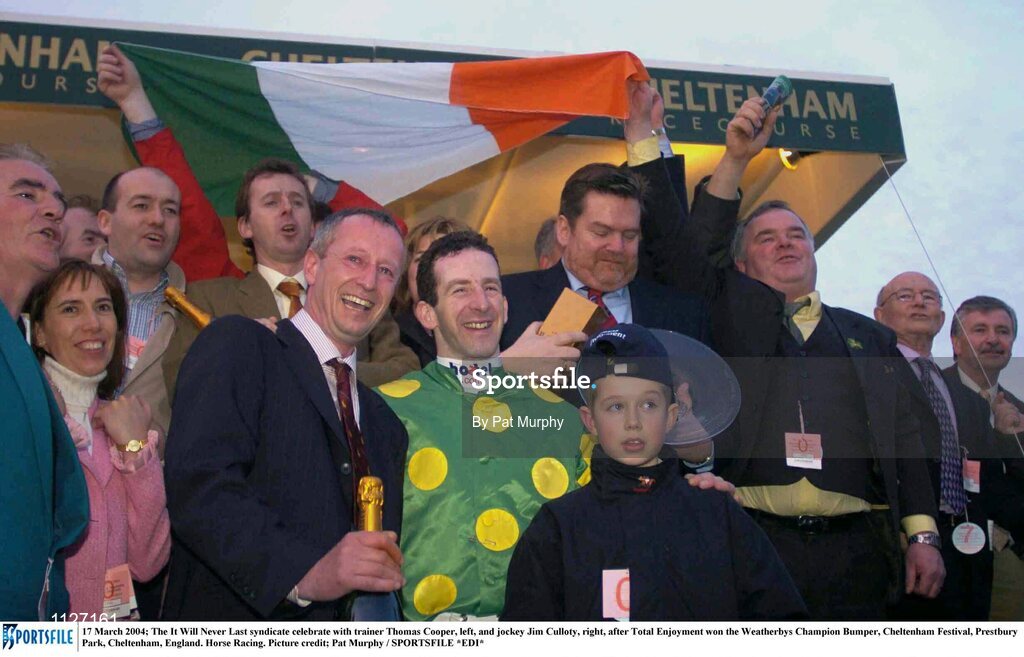 17 March 2004; The It Will Never Last syndicate celebrate with trainer Thomas Cooper, left, and jockey Jim Culloty, right, after Total Enjoyment won the Weatherbys Champion Bumper, Cheltenham Festival, Prestbury Park, Cheltenham, England. Horse Racing. Picture credit; Pat Murphy / SPORTSFILE *EDI*