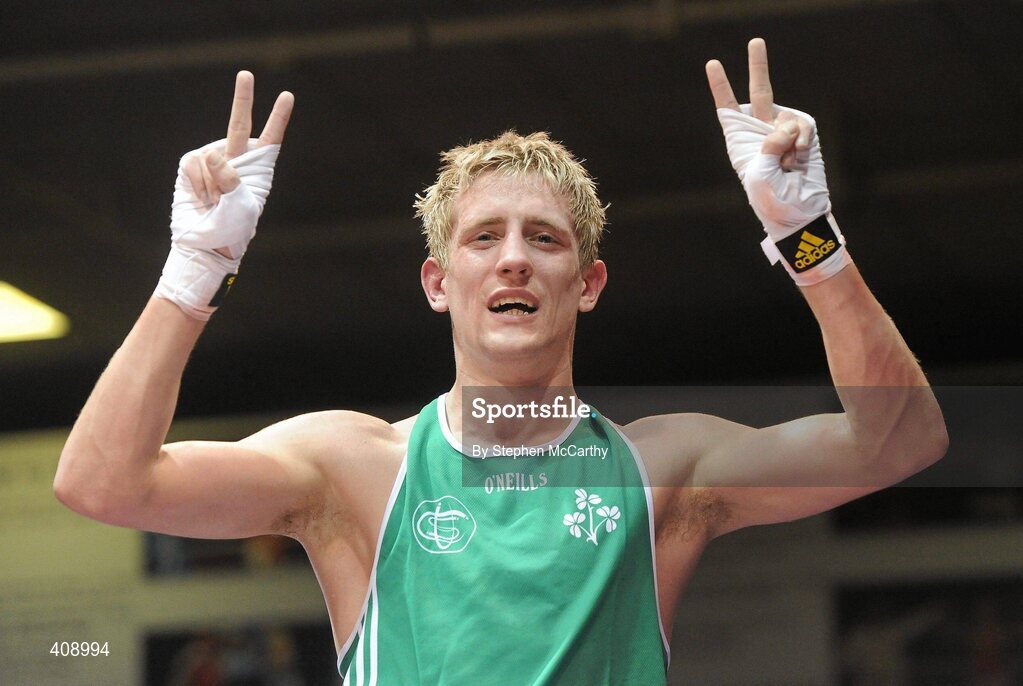 12 March 2010; Eric Donovan, Ireland, signals 2 victories each against opponent Domenico Valentino, Italy, following their 60kg bout, which Donovan won. Elite International, National Stadium, Dublin. Picture credit: Stephen McCarthy / SPORTSFILE