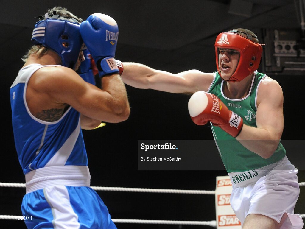 12 March 2010; Con Sheehan, Ireland, exchanges punches with Clemente Russo, Italy, during their 91kg bout. Elite International, National Stadium, Dublin. Picture credit: Stephen McCarthy / SPORTSFILE