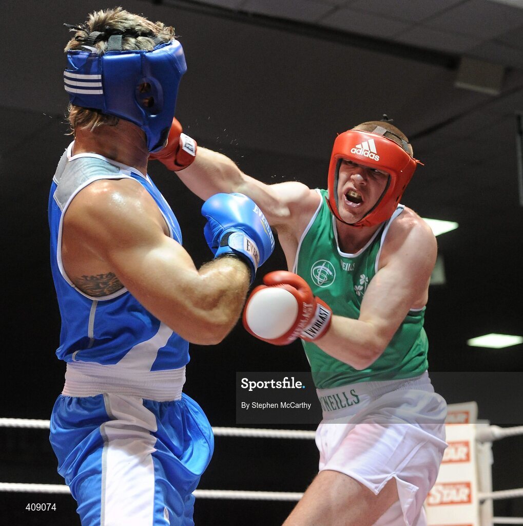 12 March 2010; Con Sheehan, Ireland, exchanges punches with Clemente Russo, Italy, during their 91kg bout. Elite International, National Stadium, Dublin. Picture credit: Stephen McCarthy / SPORTSFILE